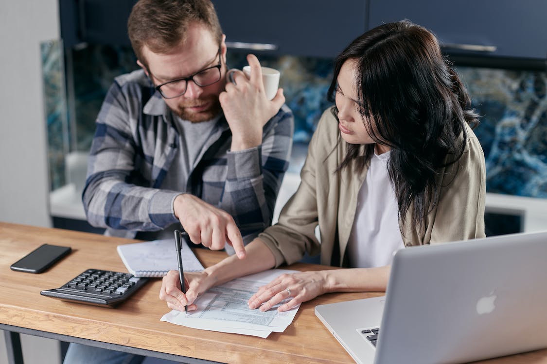 Free Couple Calculating all their Bills Stock Photo